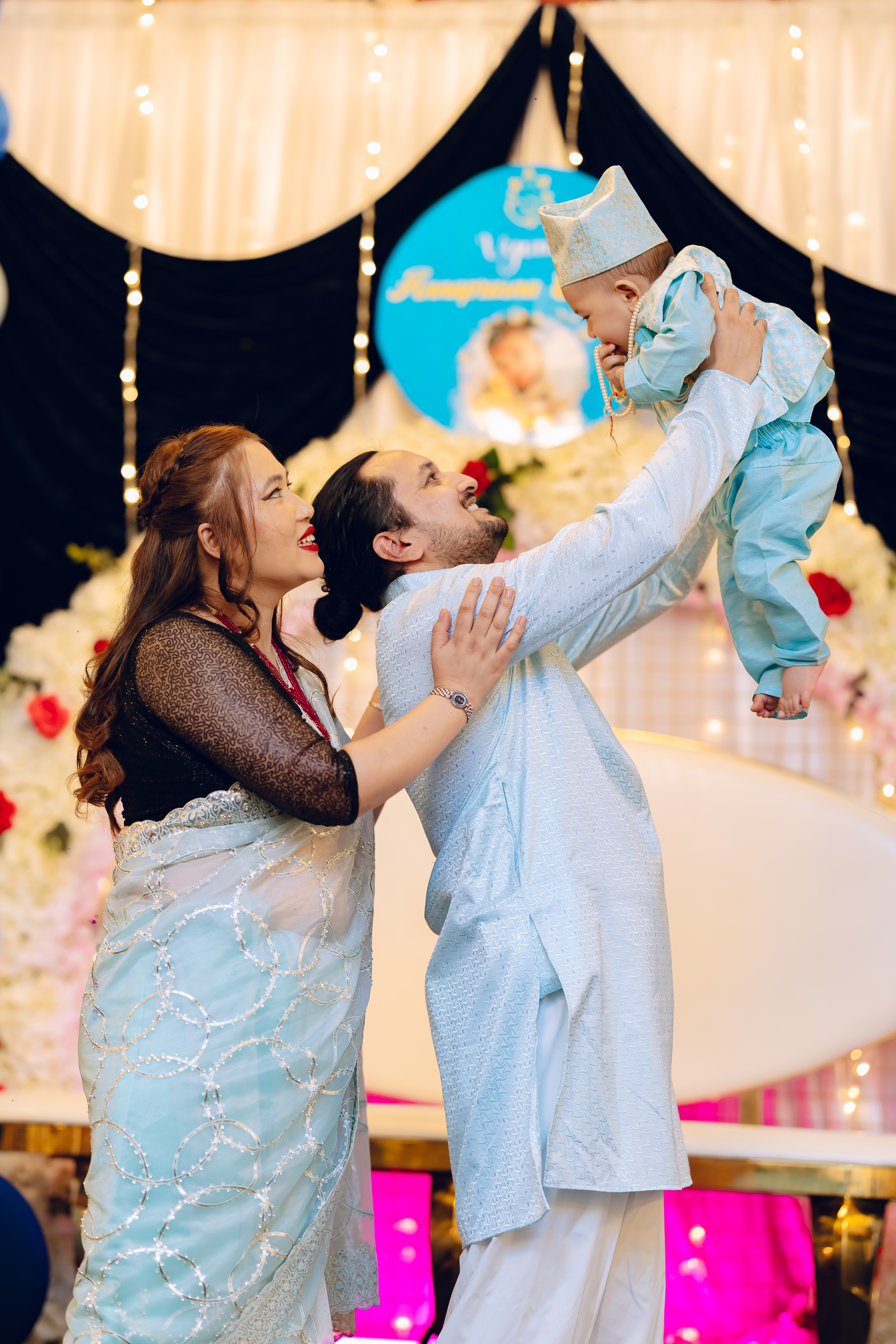 Married couple at their baby rice feeding ceremony with catering service. The event is taking place at Third Eye Windsor, 515 George St, South Windsor NSW 2756. The image captures the essence of the ceremony, showcasing the cultural significance and the beautiful setup.